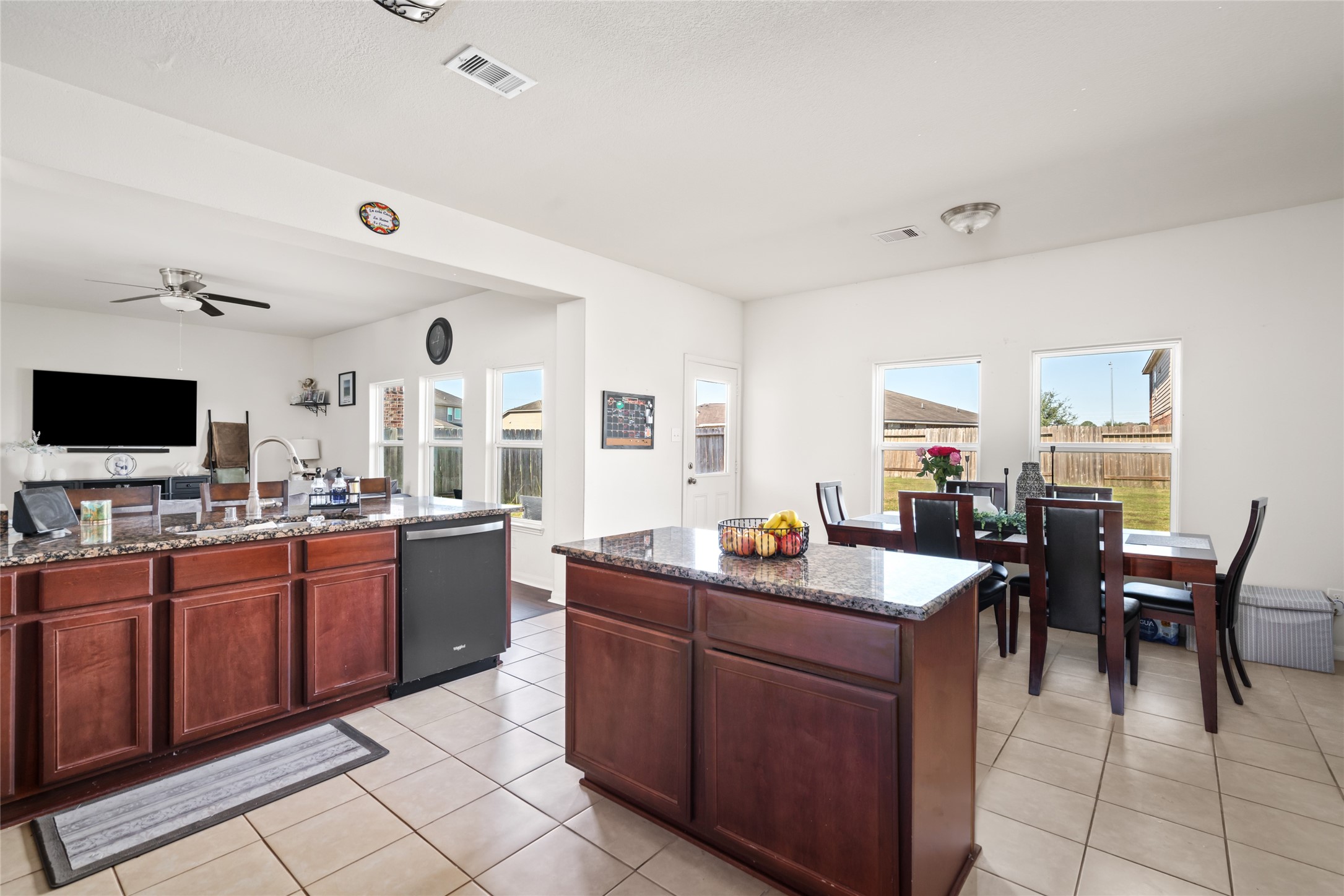 2011 Beach Bluff Road Rosenberg, TX 77469 - Photo 1 of 34 From the kitchen, you can easily see into the bright dining area, creating a seamless transition between cooking and dining. The open layout enhances the flow of the space, making it perfect for family meals and entertaining.