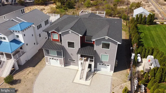 a room with wooden floors and white cabinets