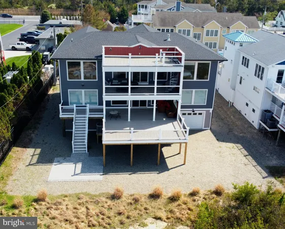 a living room with a bed furniture and a large window
