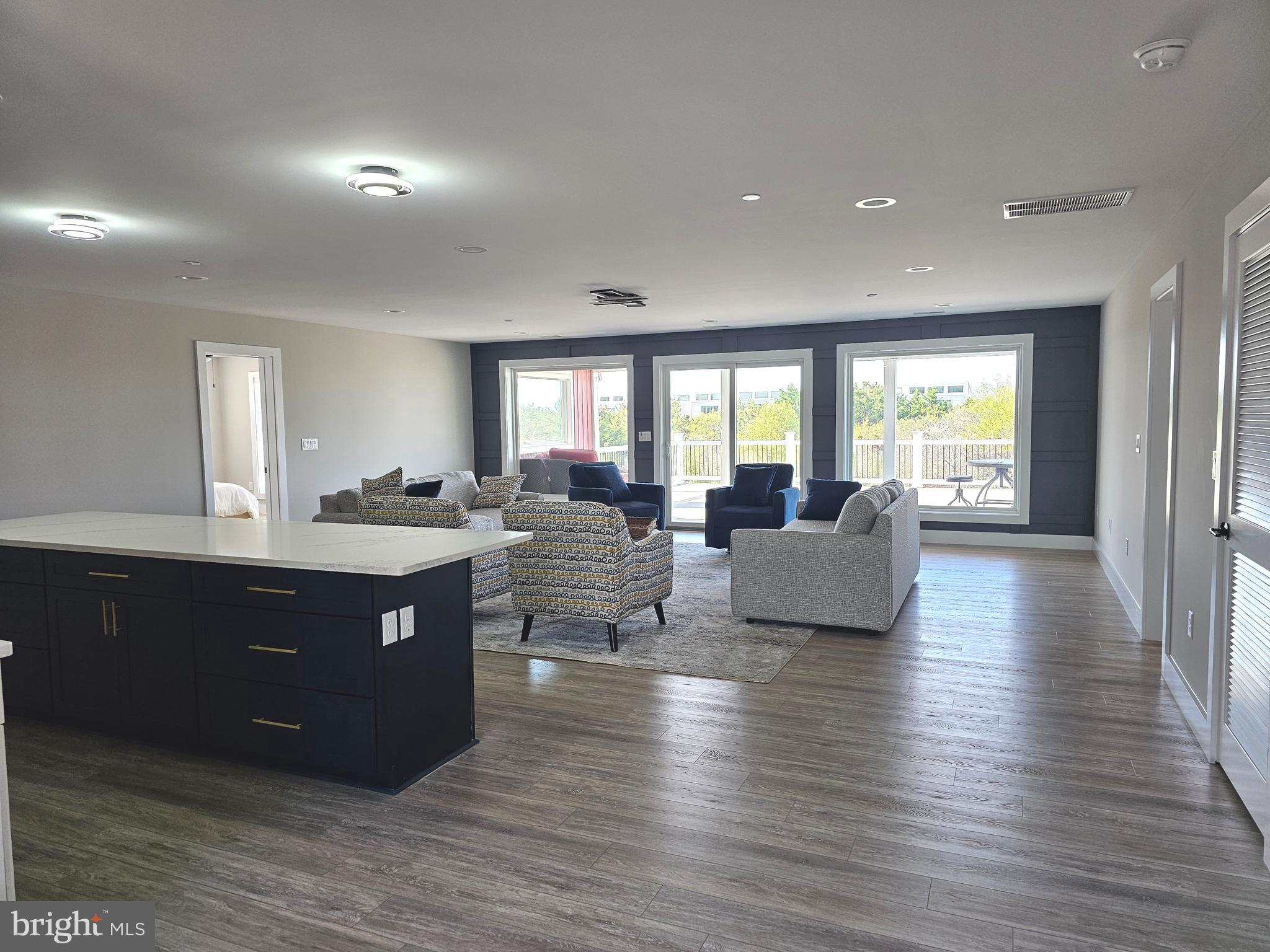 5 Warren Road Lewes, DE 19958 - Photo 17 of 76 a large room with lots of counter space and windows