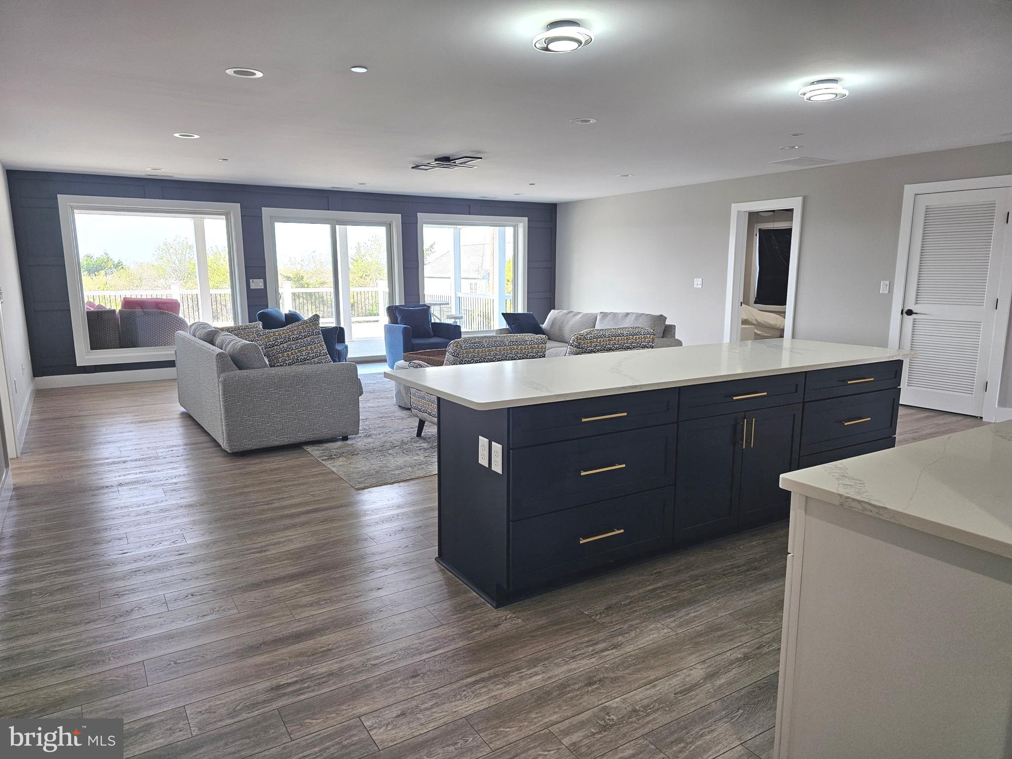 5 Warren Road Lewes, DE 19958 - Photo 19 of 76 a room with wooden floors and white cabinets