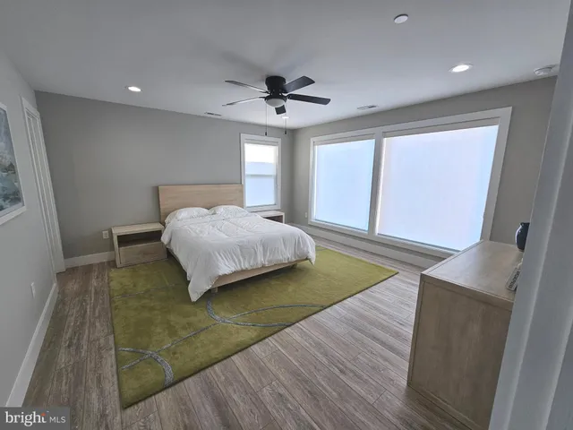 a bathroom with a toilet sink and shower