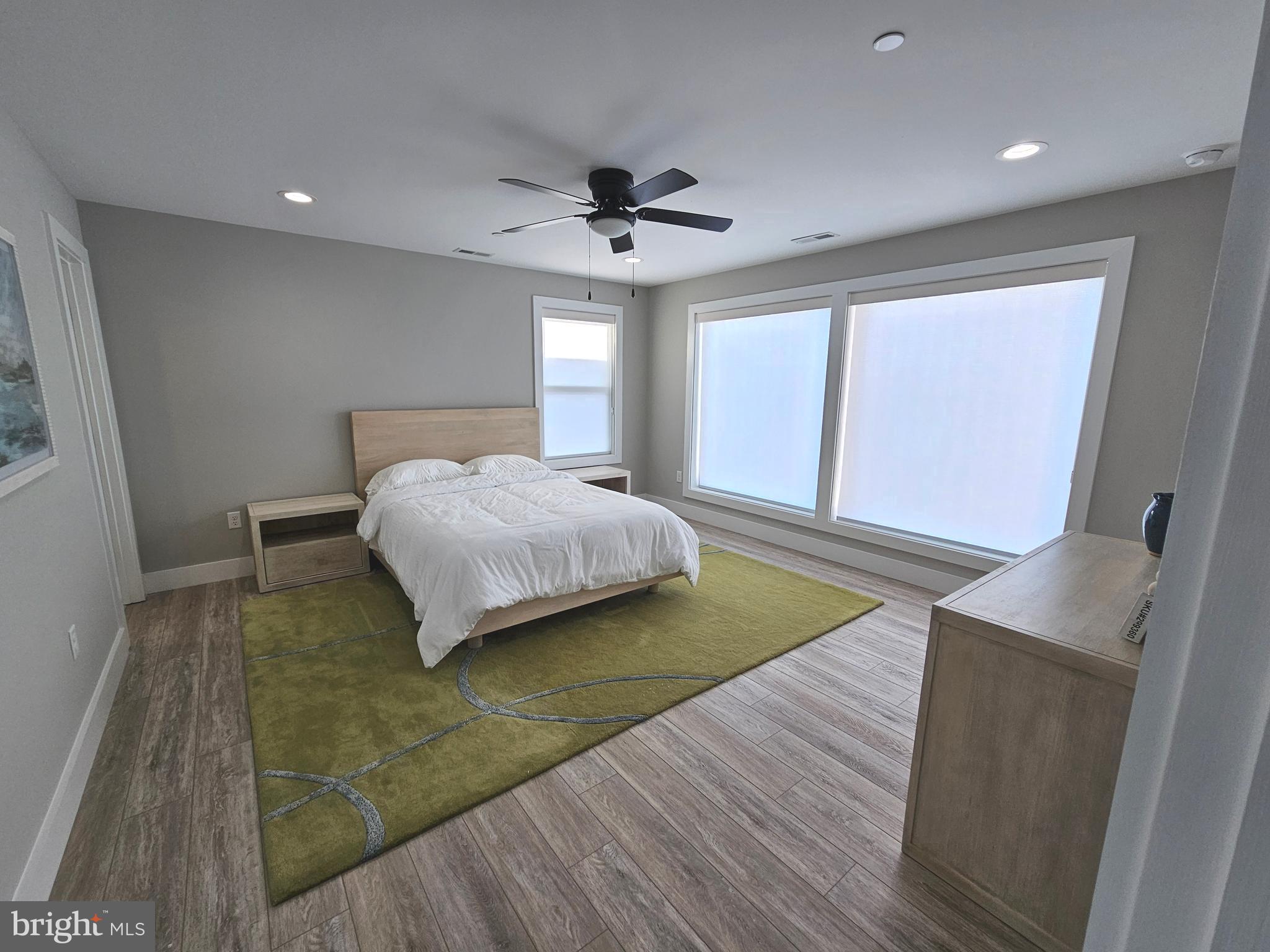 5 Warren Road Lewes, DE 19958 - Photo 20 of 76 a bedroom with a bed and a walk in closet