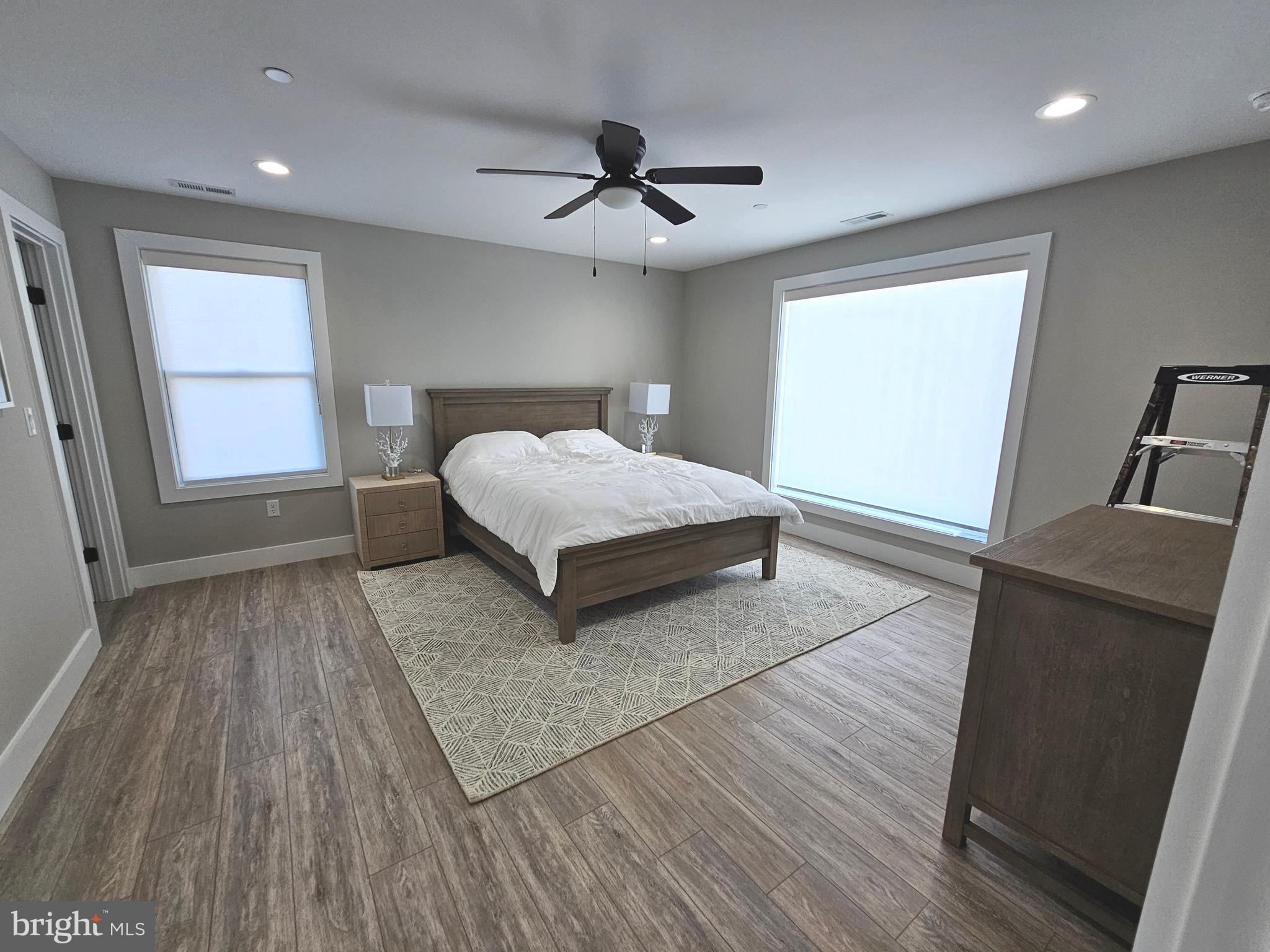 5 Warren Road Lewes, DE 19958 - Photo 24 of 76 a living room with a bed furniture and a large window