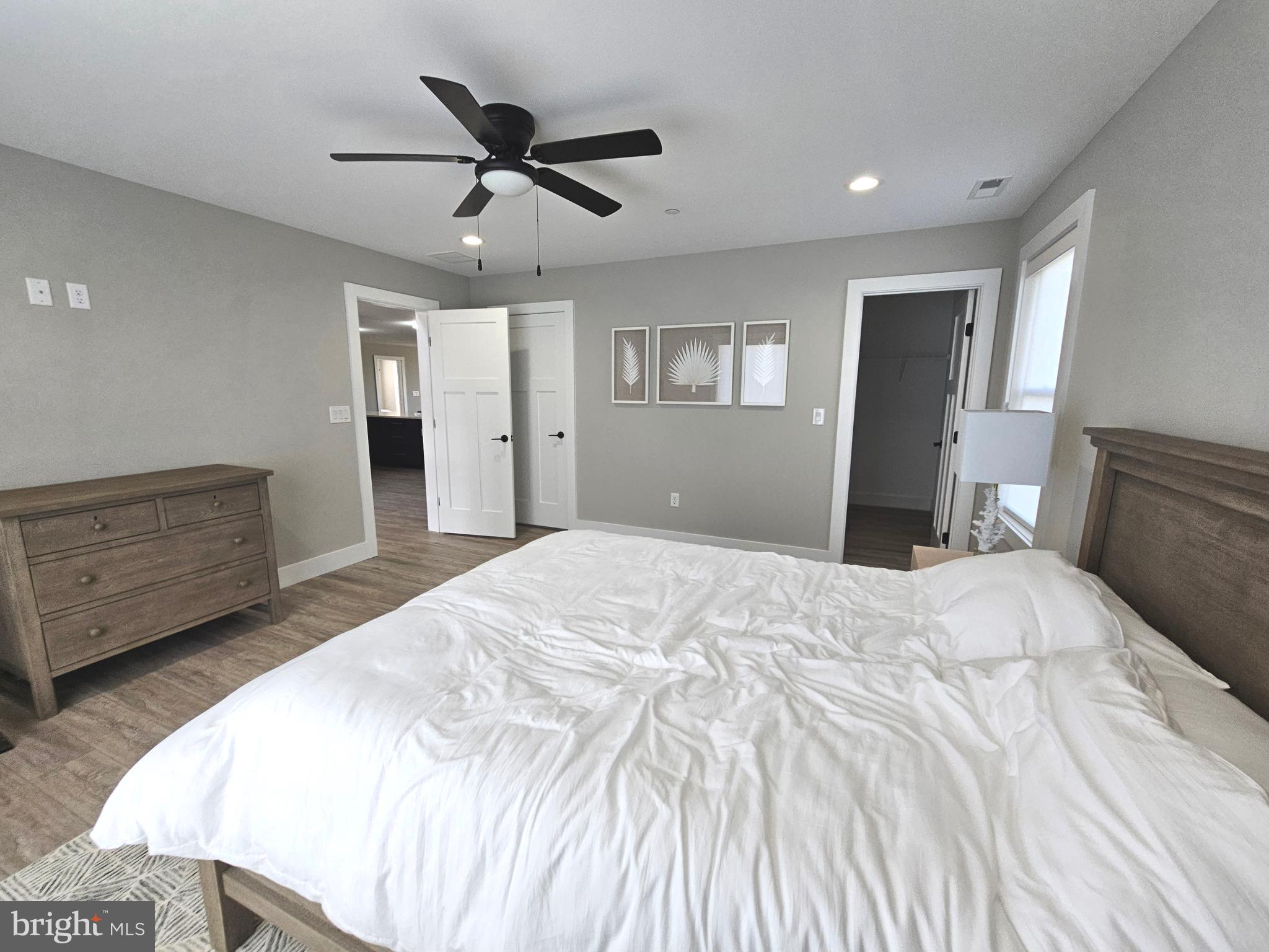 5 Warren Road Lewes, DE 19958 - Photo 25 of 76 a bedroom with a bed and a dresser