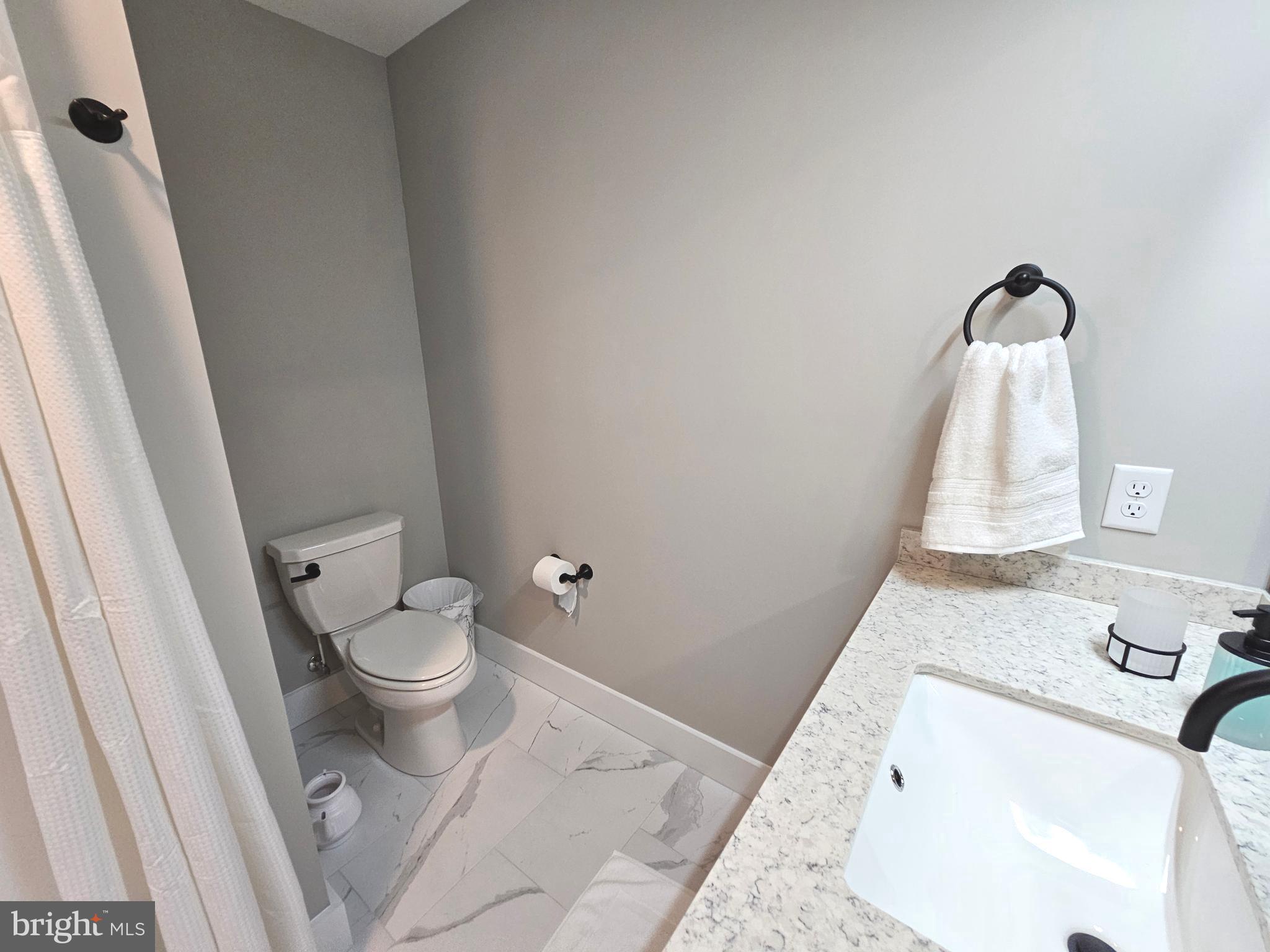 5 Warren Road Lewes, DE 19958 - Photo 28 of 76 a bathroom with a sink and toilet