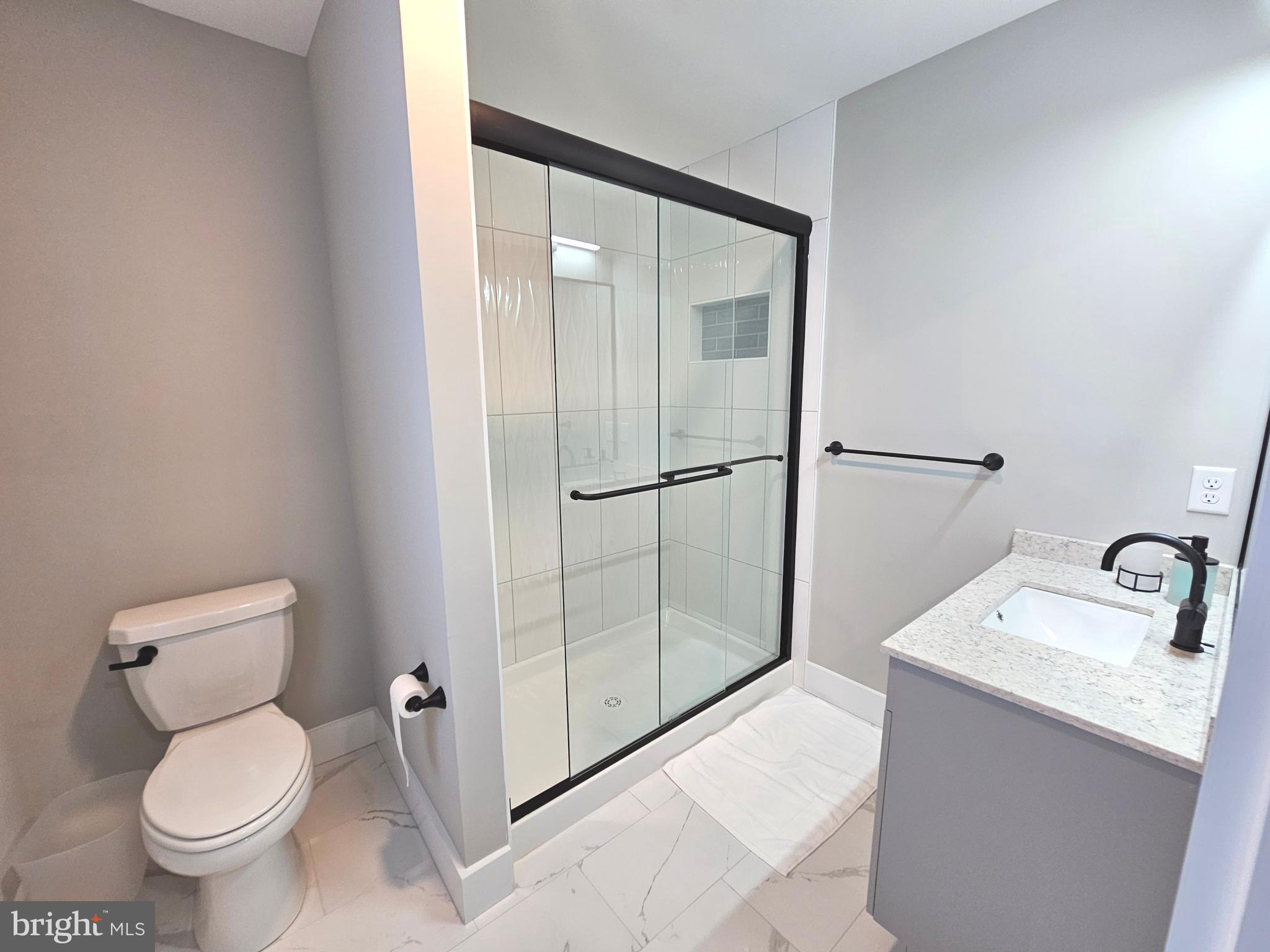 5 Warren Road Lewes, DE 19958 - Photo 32 of 76 a bathroom with a toilet sink and shower