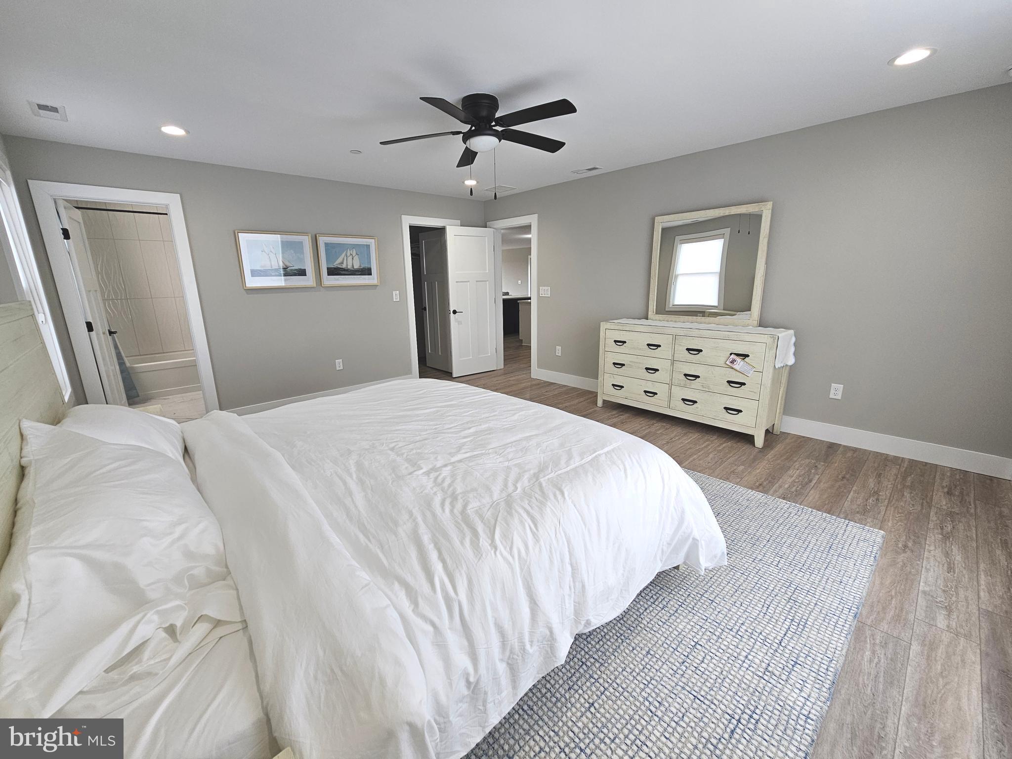 5 Warren Road Lewes, DE 19958 - Photo 38 of 76 a bedroom with a bed and a dresser
