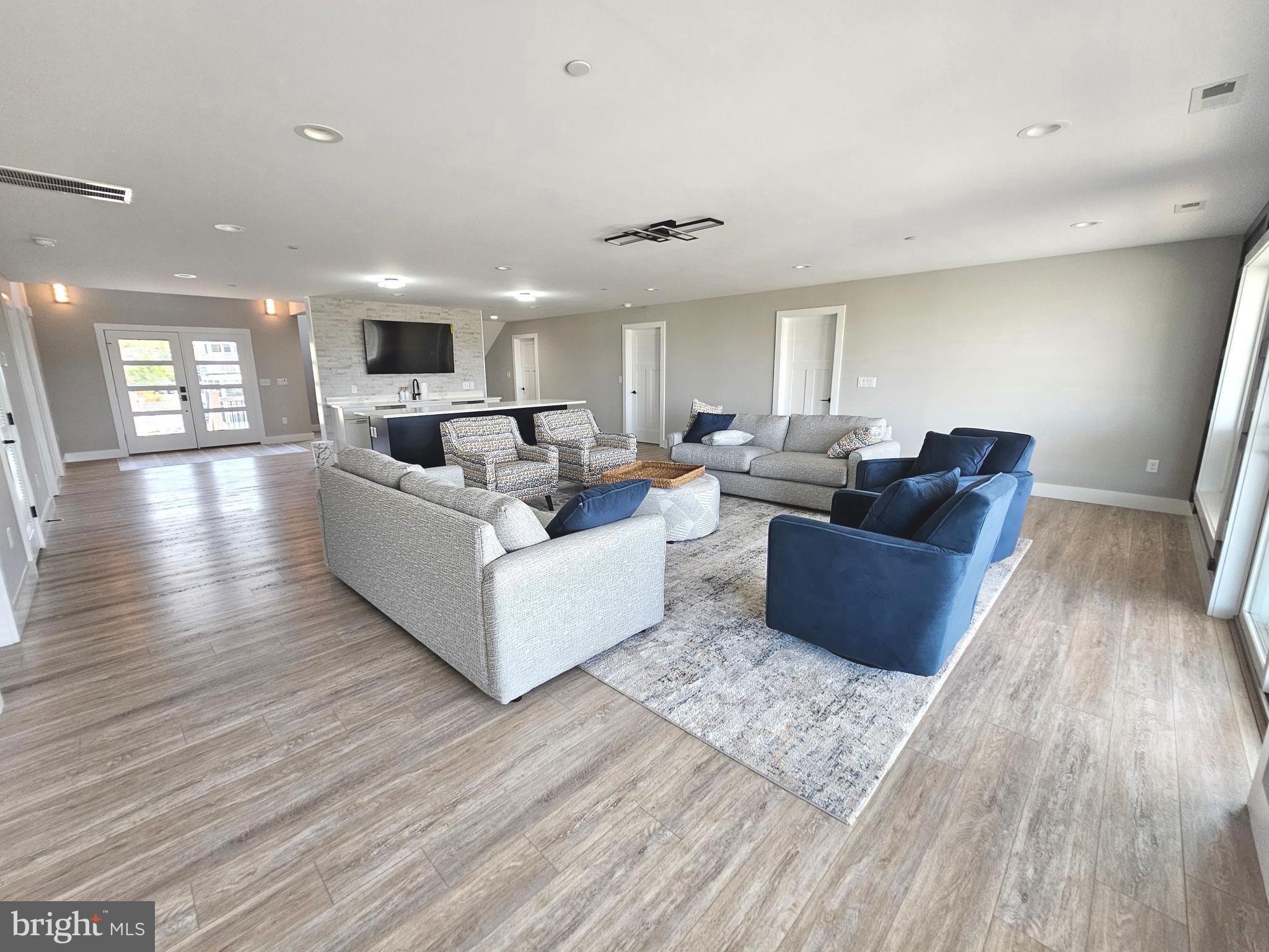 5 Warren Road Lewes, DE 19958 - Photo 39 of 76 a living room with furniture and a hard wood floor