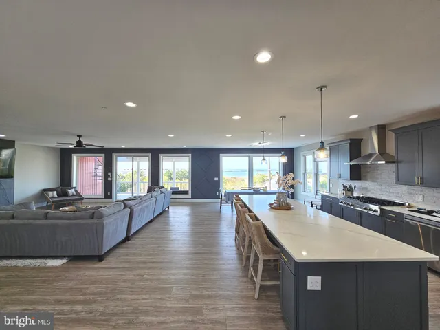 a view of a livingroom with furniture and a window
