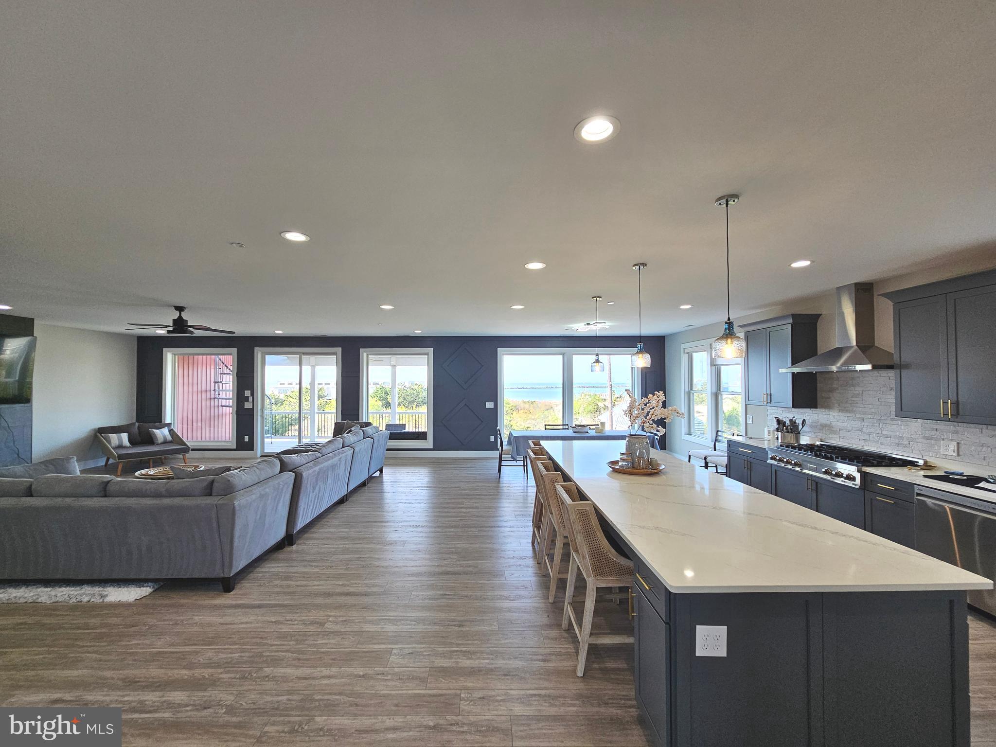 5 Warren Road Lewes, DE 19958 - Photo 50 of 76 a large kitchen with lots of counter space a sink appliances and living room view
