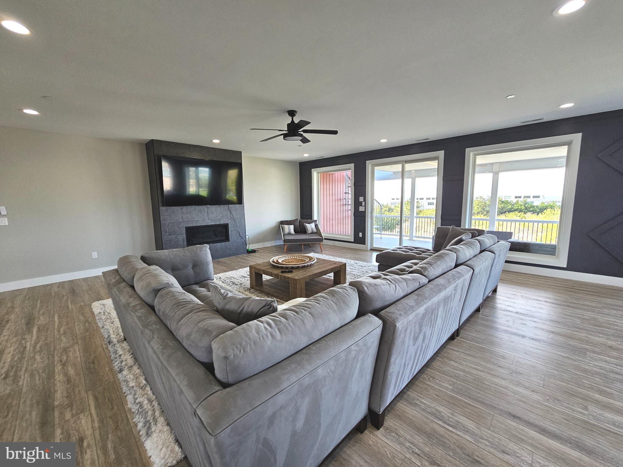 5 Warren Road Lewes, DE 19958 - Photo 59 of 76 a living room with furniture and a flat screen tv