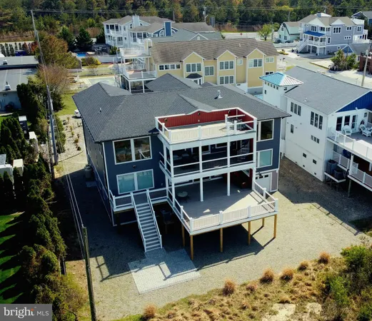 a front view of a house with large windows