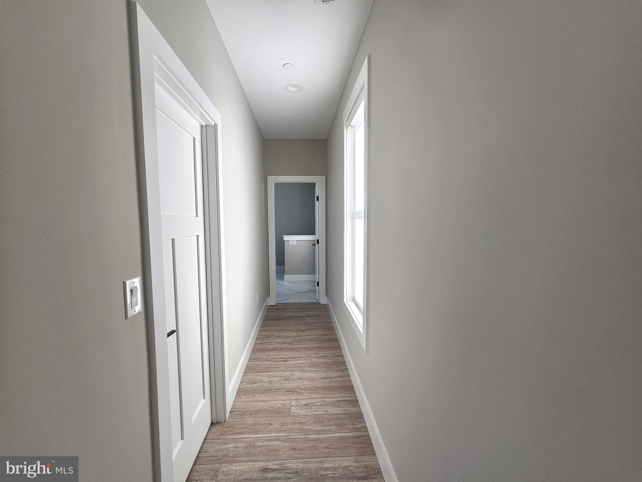 5 Warren Road Lewes, DE 19958 - Photo 64 of 76 a view of a hallway with a white walls