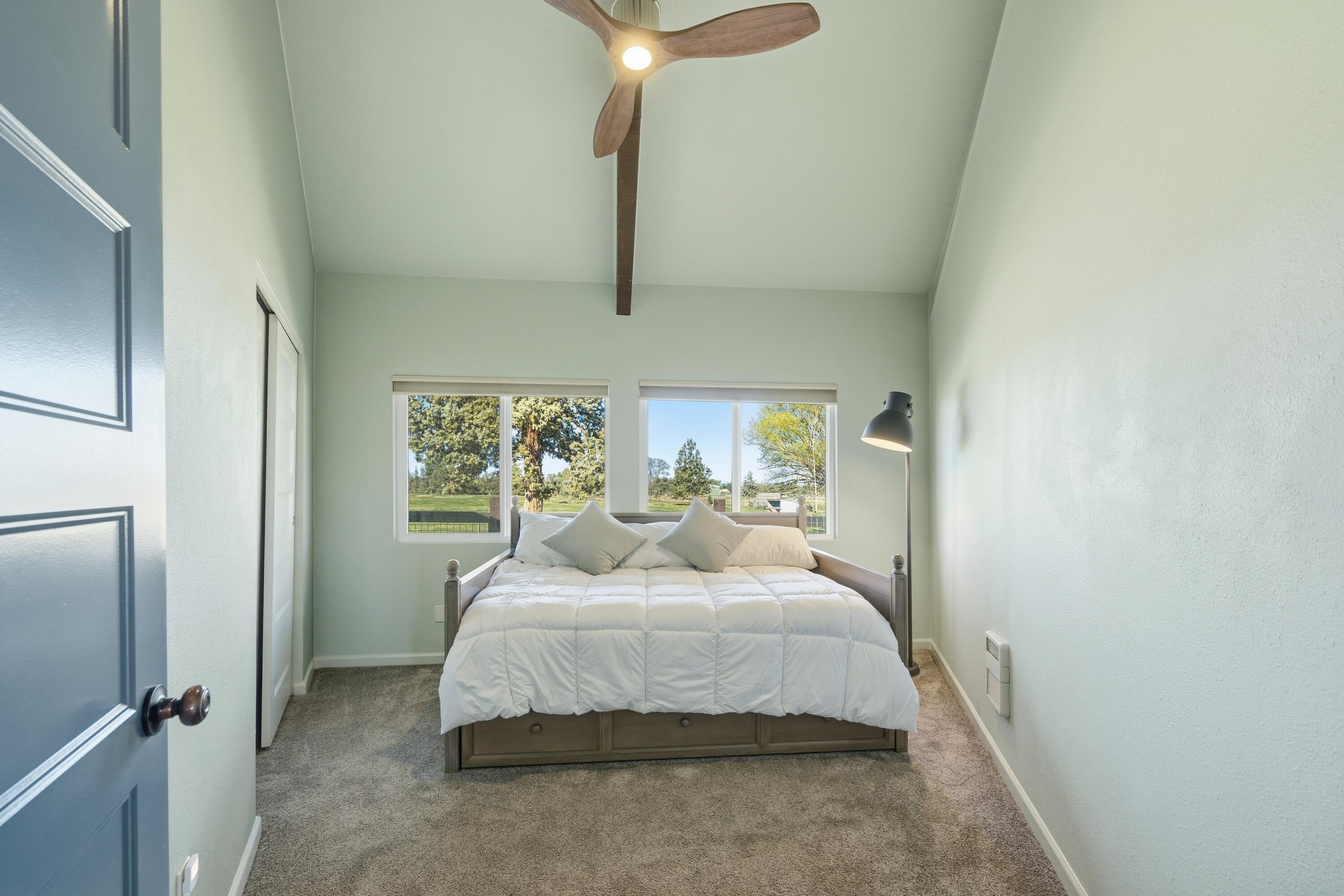 4074 Southwest Reif Road Powell Butte, OR 97753 - Photo 20 of 59 a bedroom with a bed and a large mirror