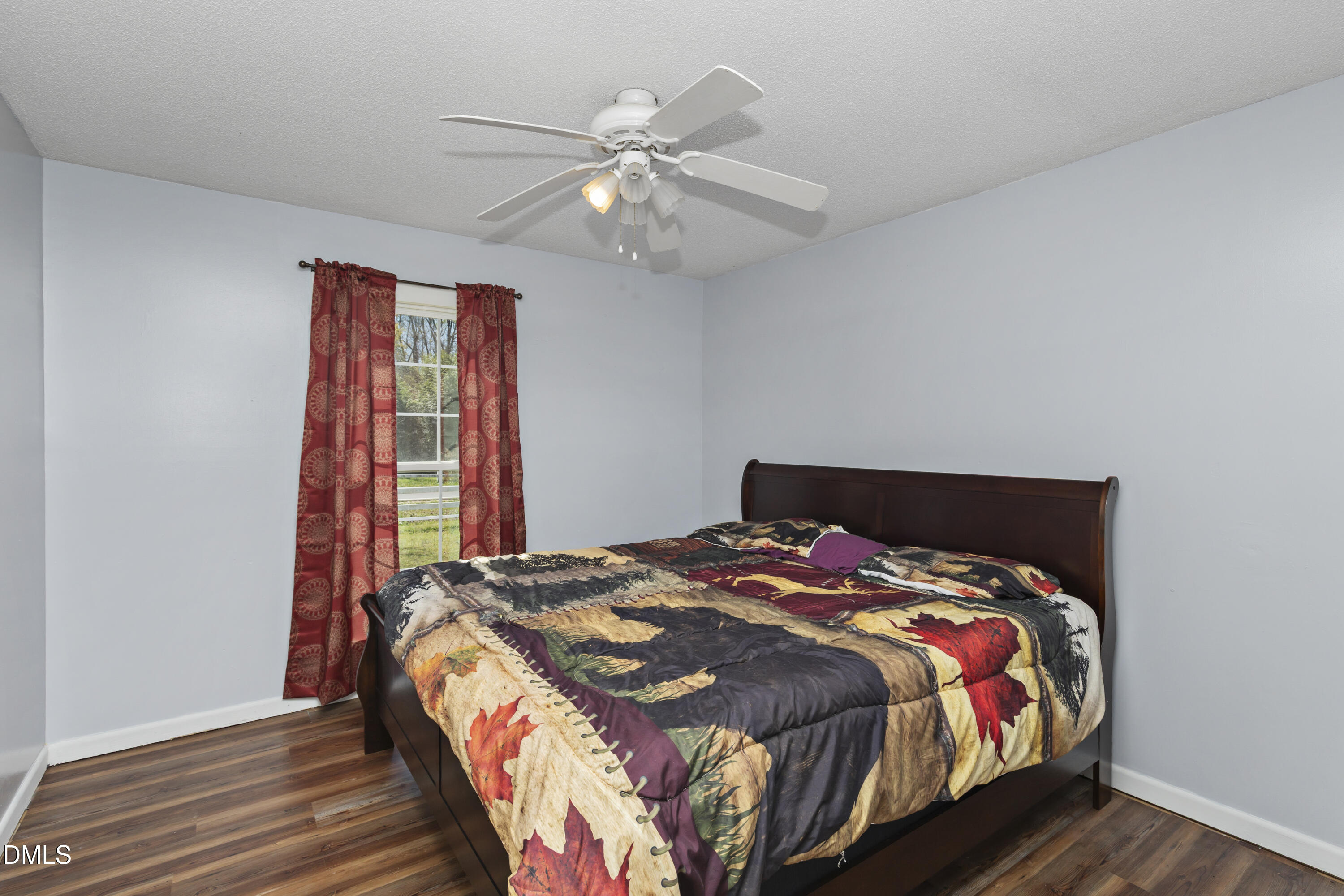 288 Baileys Crossroads Road Benson, NC 27504 - Photo 14 of 26 a bedroom with a bed and window