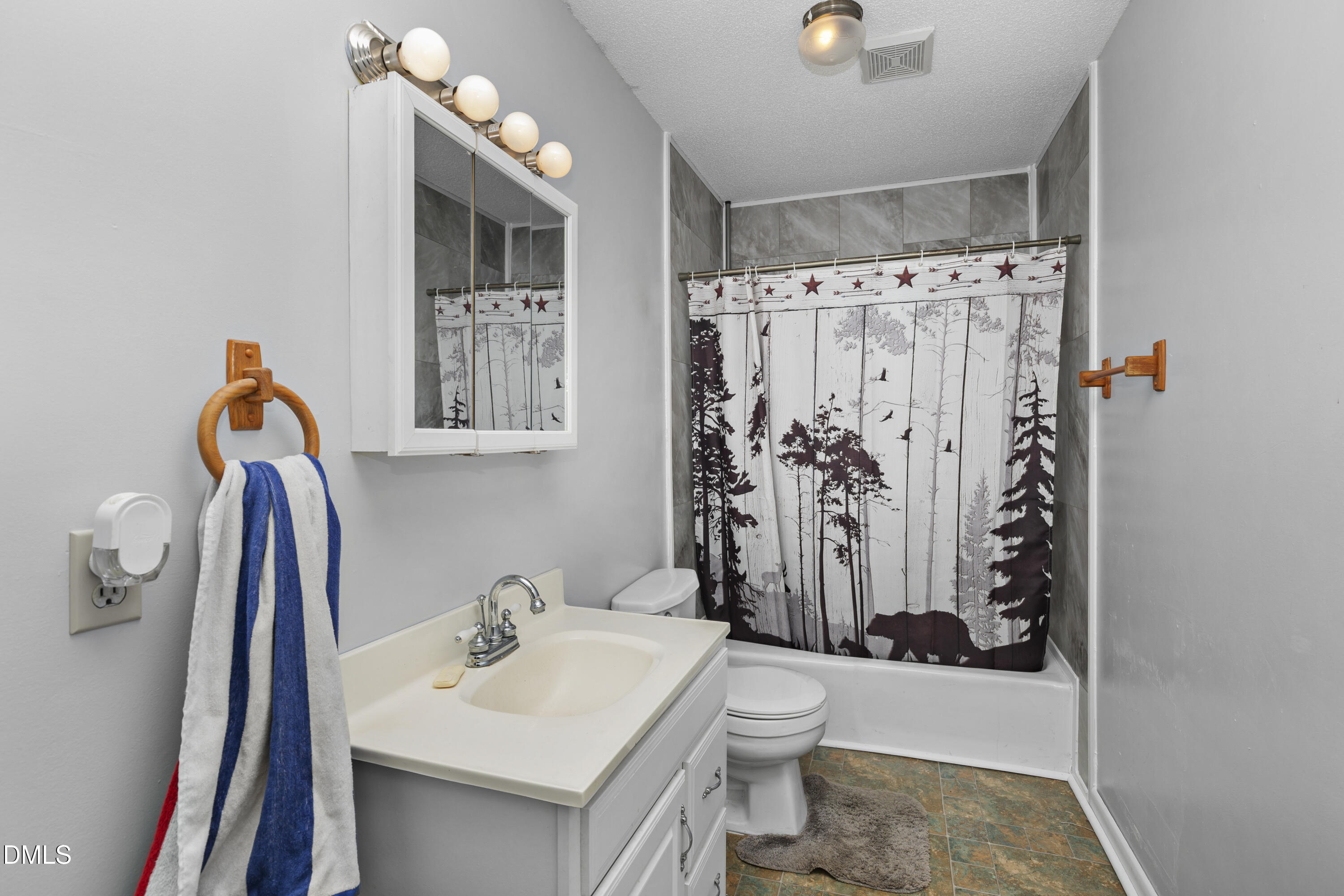 288 Baileys Crossroads Road Benson, NC 27504 - Photo 16 of 26 a bathroom with a sink toilet and shower