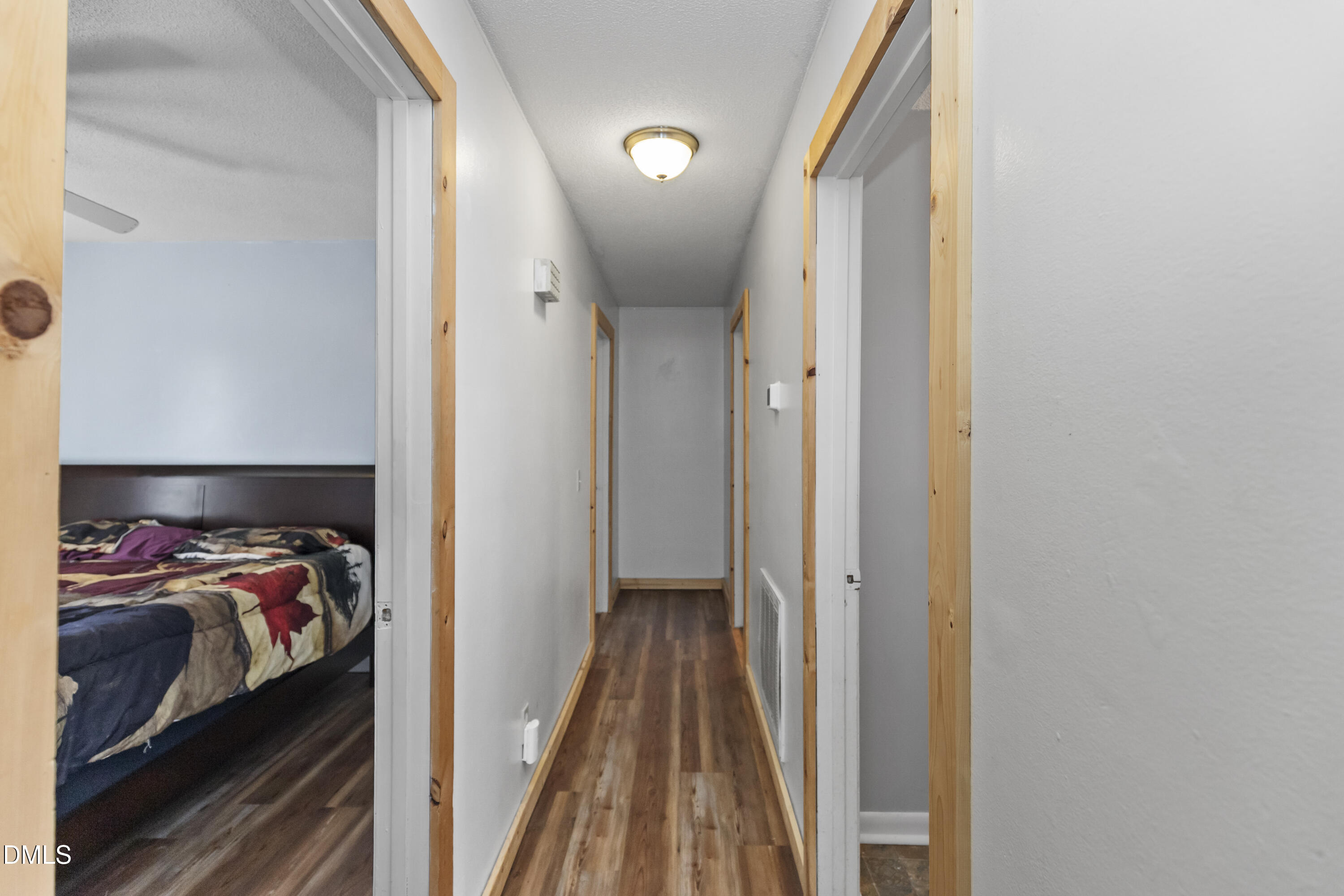 288 Baileys Crossroads Road Benson, NC 27504 - Photo 19 of 26 a view of a hallway to a livingroom with furniture