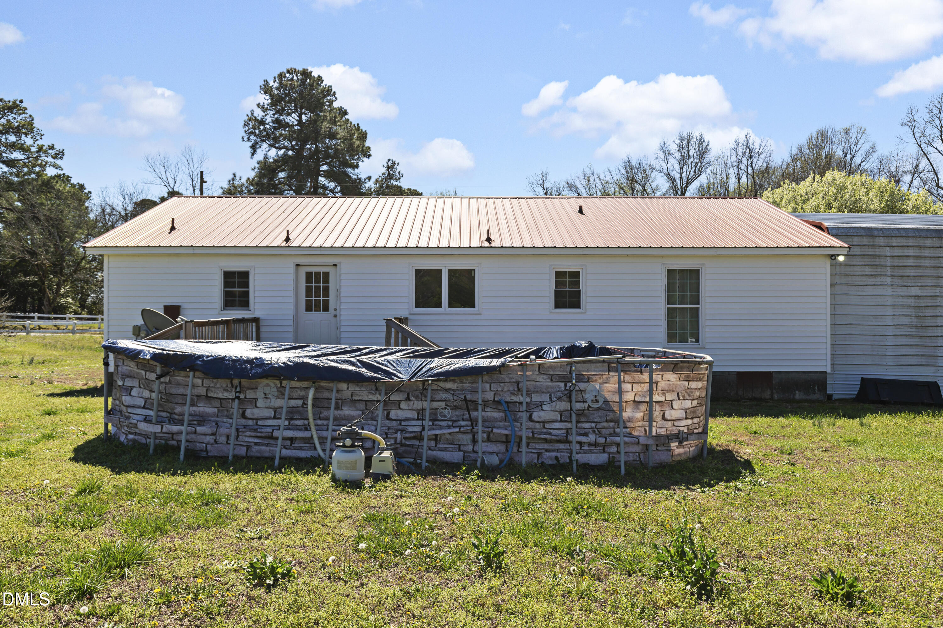 288 Baileys Crossroads Road Benson, NC 27504 - Photo 20 of 26 a view of a house with backyard and sitting area