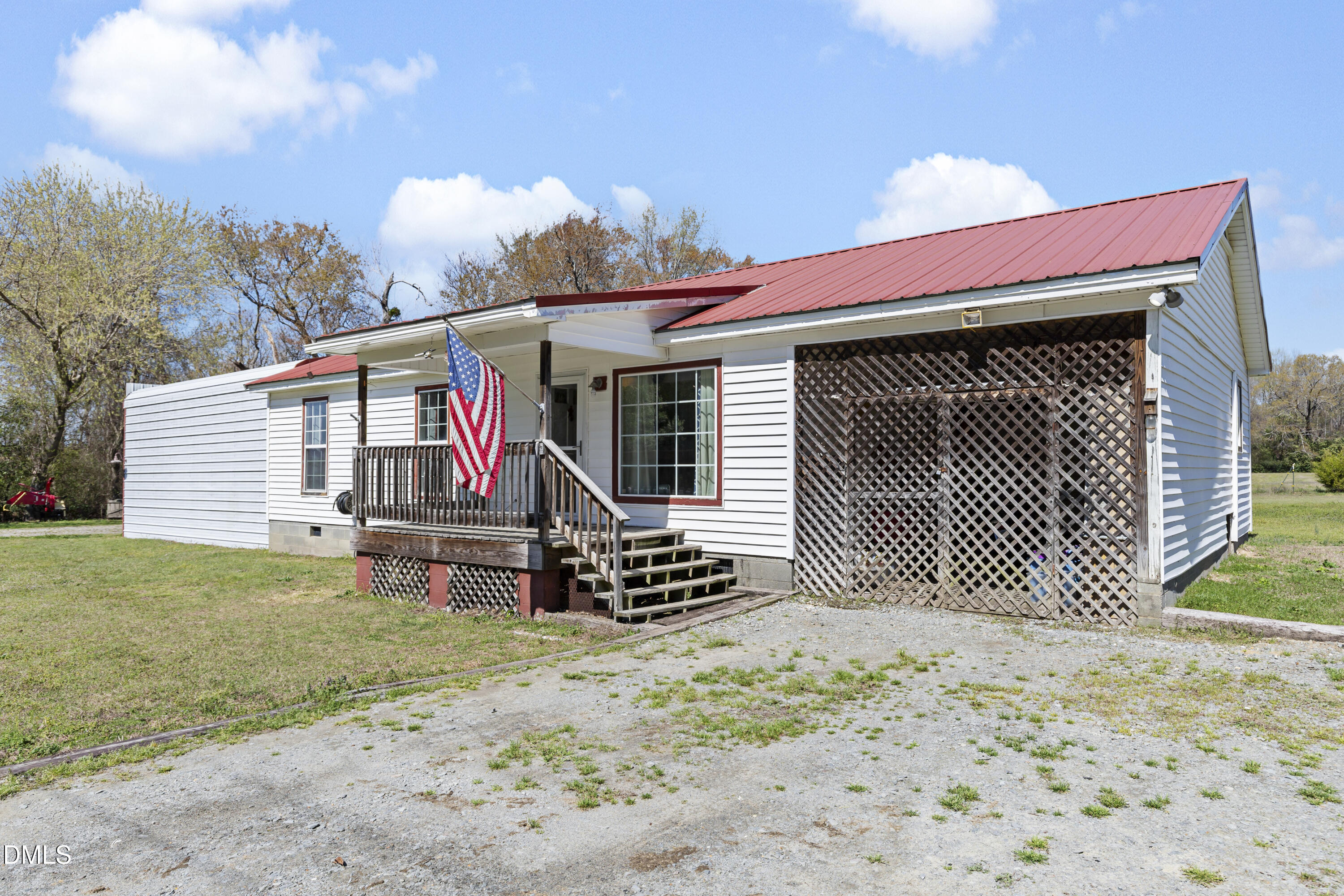 288 Baileys Crossroads Road Benson, NC 27504 - Photo 2 of 26 a view of a house with a yard and wooden fence