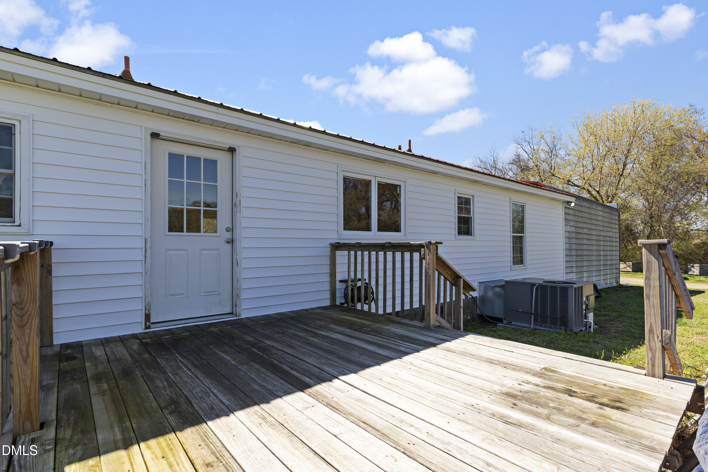 288 Baileys Crossroads Road Benson, NC 27504 - Photo 21 of 26 a view of a house with wooden deck