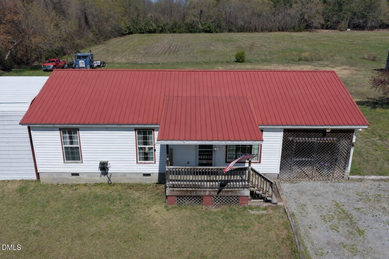 288 Baileys Crossroads Road Benson, NC 27504 - Photo 26 of 26 a backyard of a house with barbeque oven