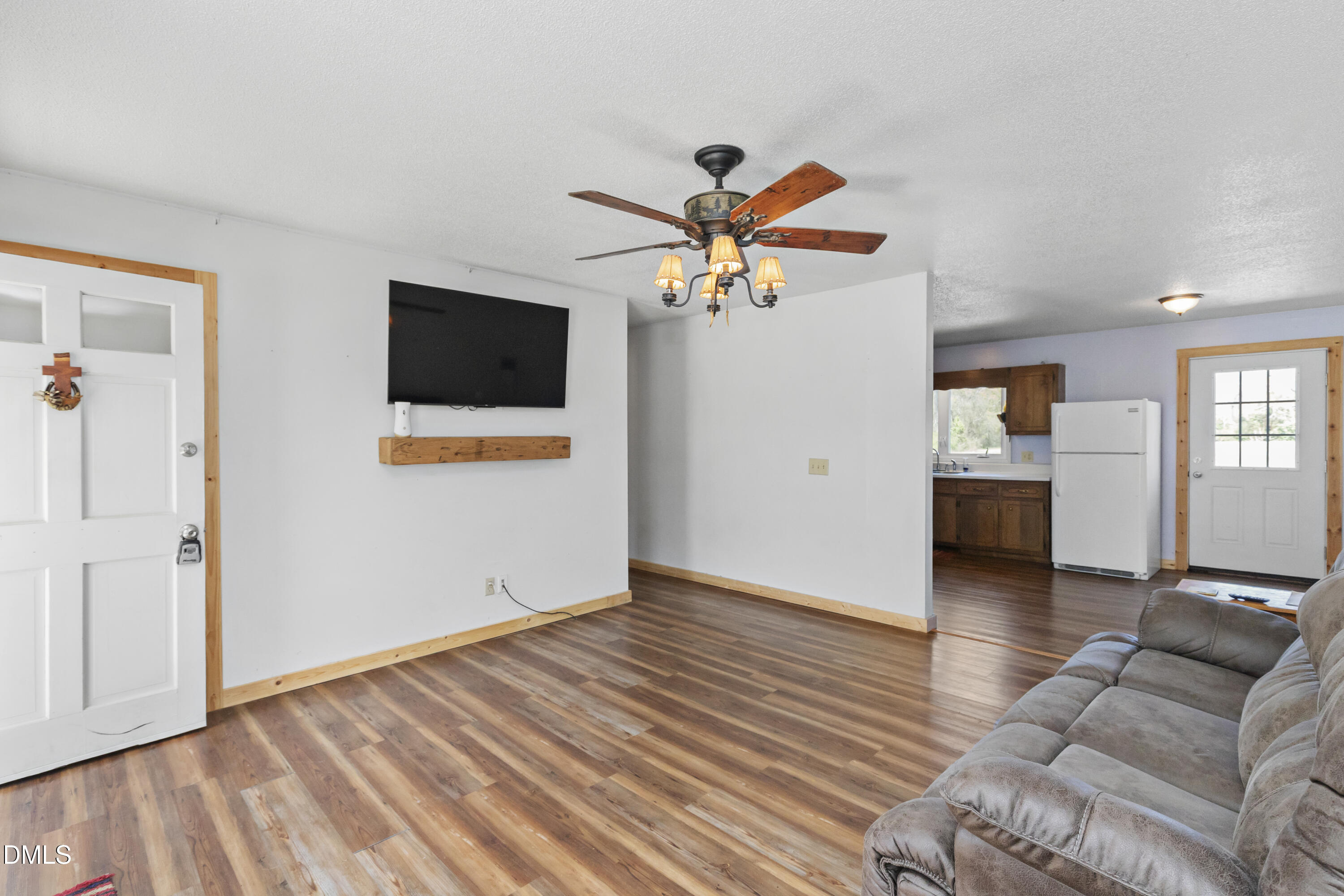 288 Baileys Crossroads Road Benson, NC 27504 - Photo 5 of 26 a living room with furniture and a flat screen tv