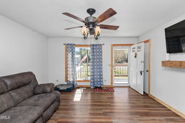 a living room with furniture and a flat screen tv