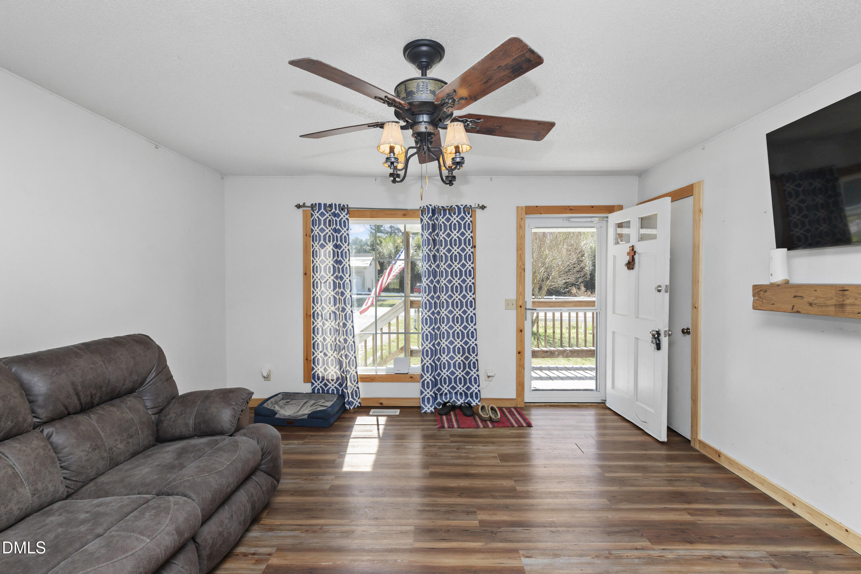 288 Baileys Crossroads Road Benson, NC 27504 - Photo 6 of 26 a living room with furniture and a flat screen tv