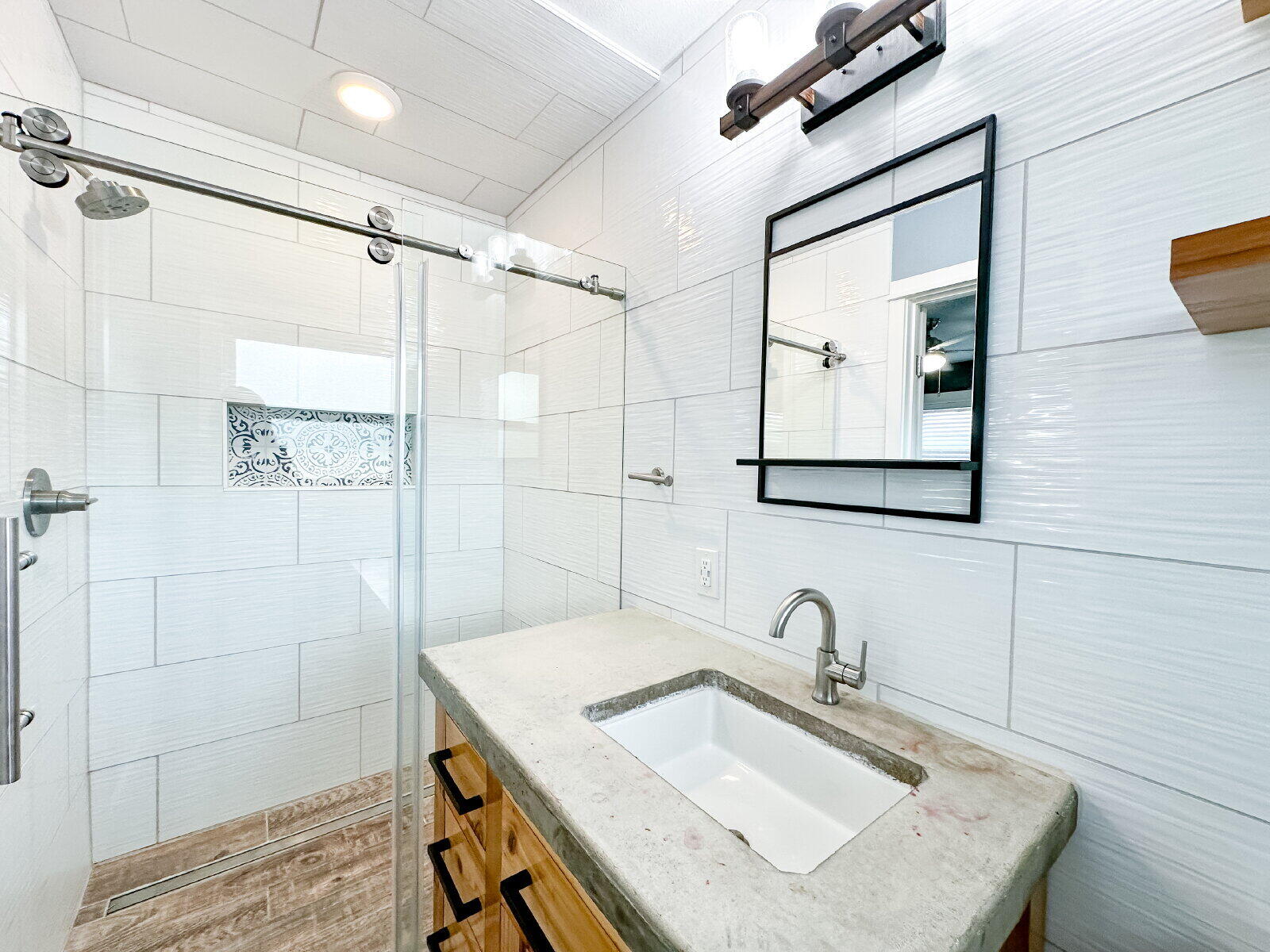 2608 Raleigh Avenue Lubbock, TX 79410 - Photo 8 of 23 a bathroom with a sink shower vanity and a mirror
