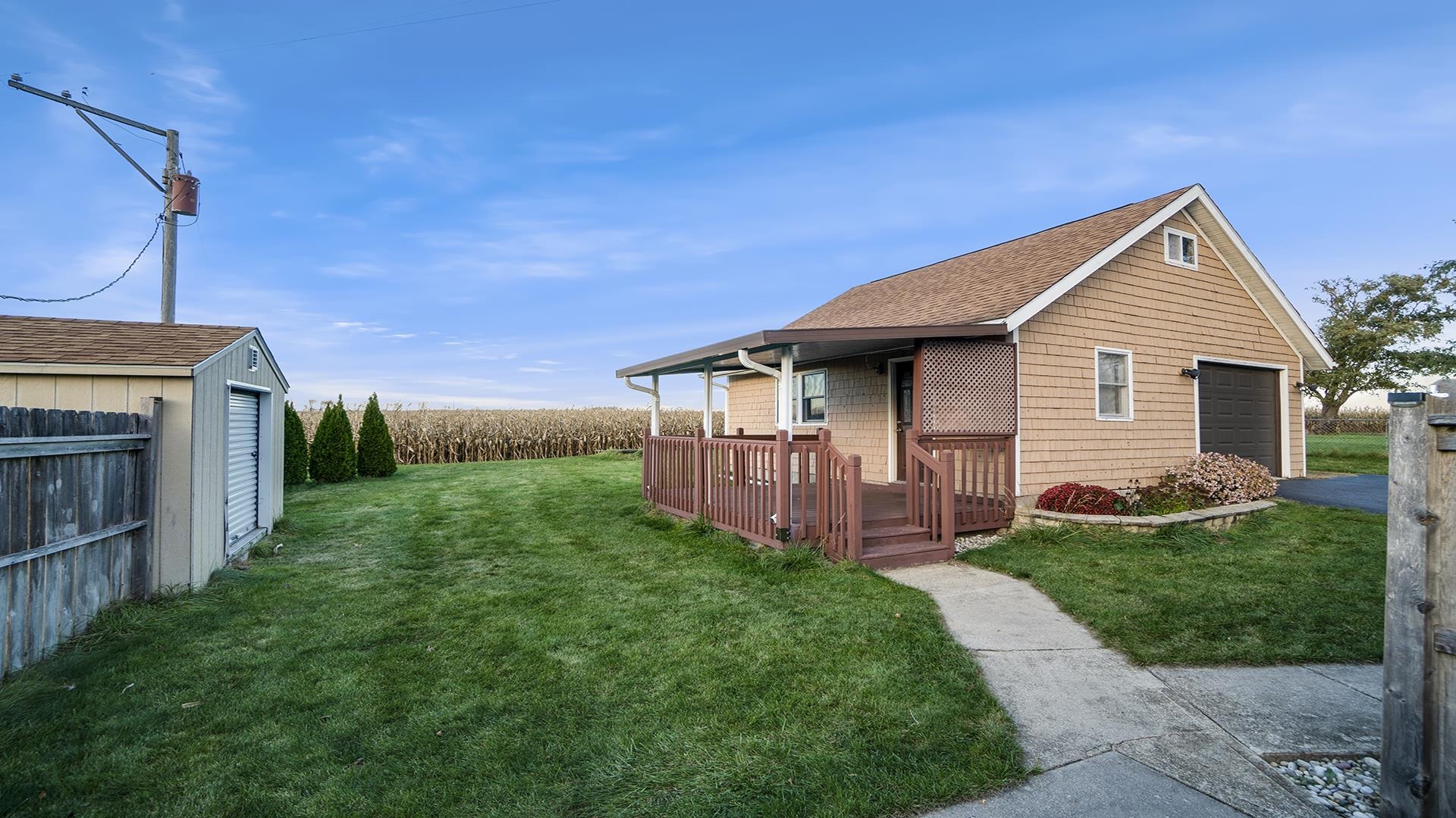 2650 Orth Road Belvidere, IL 61008 - Photo 5 of 25 a view of a house with a yard and deck
