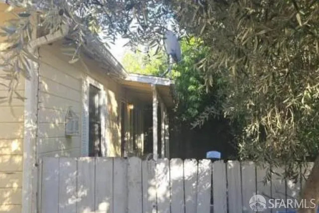 a view of a house with a tree