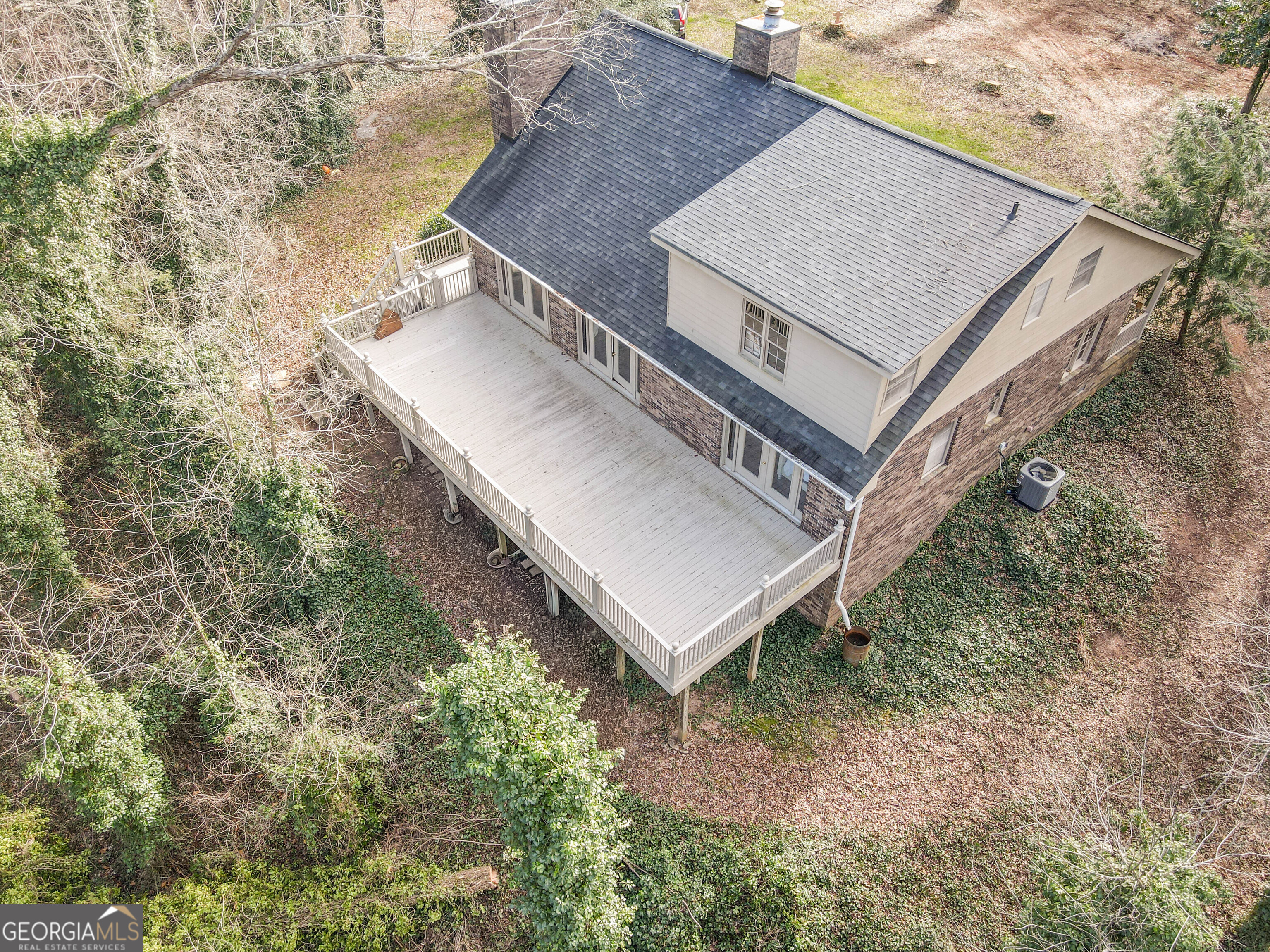 151 Evans Road Milner, GA 30257 - Photo 33 of 53 a view of a house with a yard and deck