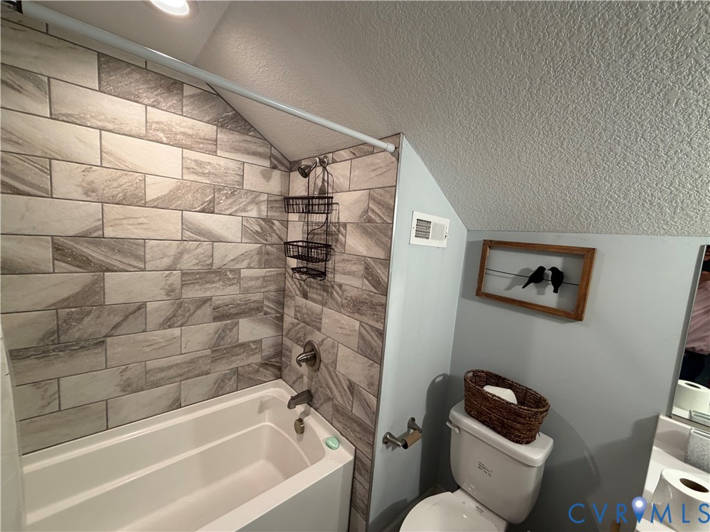 1124 Myrtle Street Suffolk, VA 23434 - Photo 14 of 15 Bathroom featuring a white bathtub, gray-toned rec