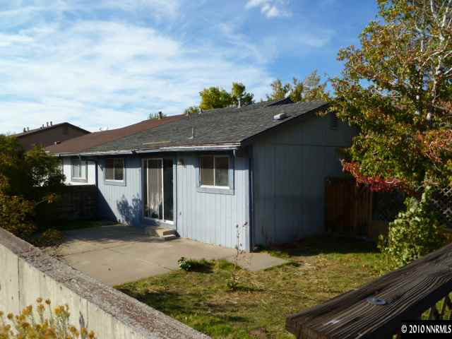 6720 Peppermint Drive Reno, NV 89506 - Photo 4 of 7 a front view of a house with garden