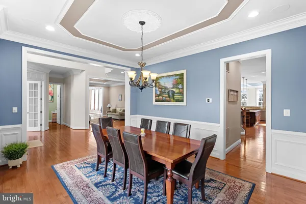 a large kitchen with a table and chairs