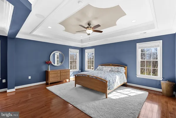 a spacious bedroom with a bed and a window