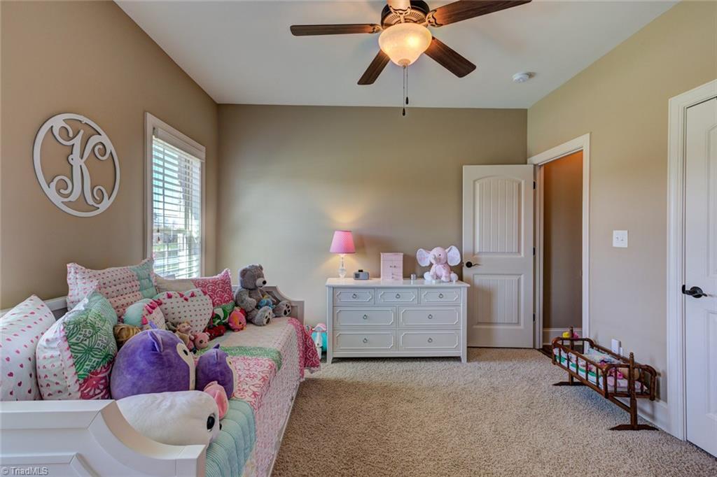 8889 Rymack Drive Oak Ridge, NC 27310 - Photo 20 of 30 Another main level bedroom also has walk in closet