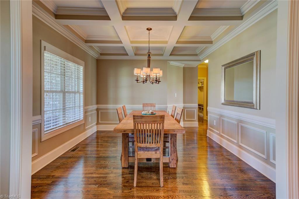 8889 Rymack Drive Oak Ridge, NC 27310 - Photo 3 of 30 Elegant dining room with coffered ceiling detail.