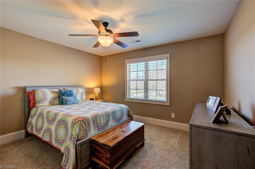 8889 Rymack Drive Oak Ridge, NC 27310 - Photo 22 of 30 Upper level bedroom