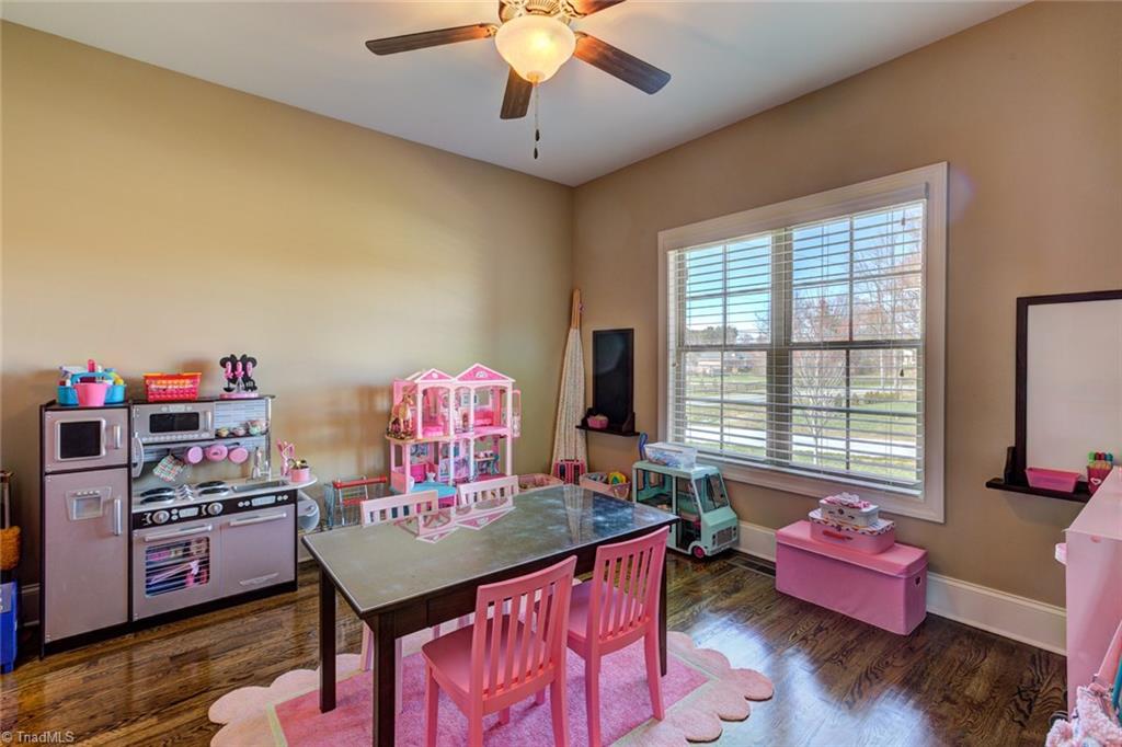 8889 Rymack Drive Oak Ridge, NC 27310 - Photo 23 of 30 Main level office has closet space and doors for privacy.