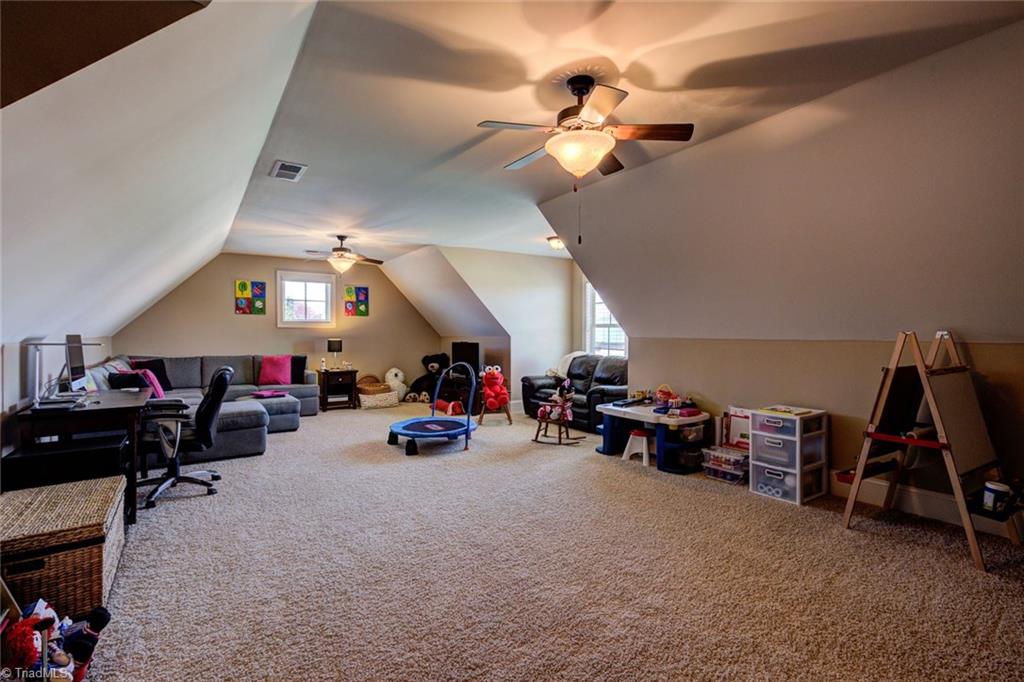 8889 Rymack Drive Oak Ridge, NC 27310 - Photo 24 of 30 Expansive bonus room