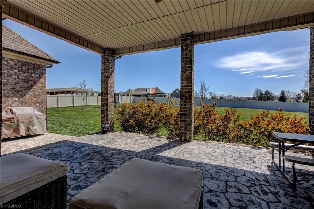 8889 Rymack Drive Oak Ridge, NC 27310 - Photo 27 of 30 Your view! The gas grill is plumbed with natural gas.
