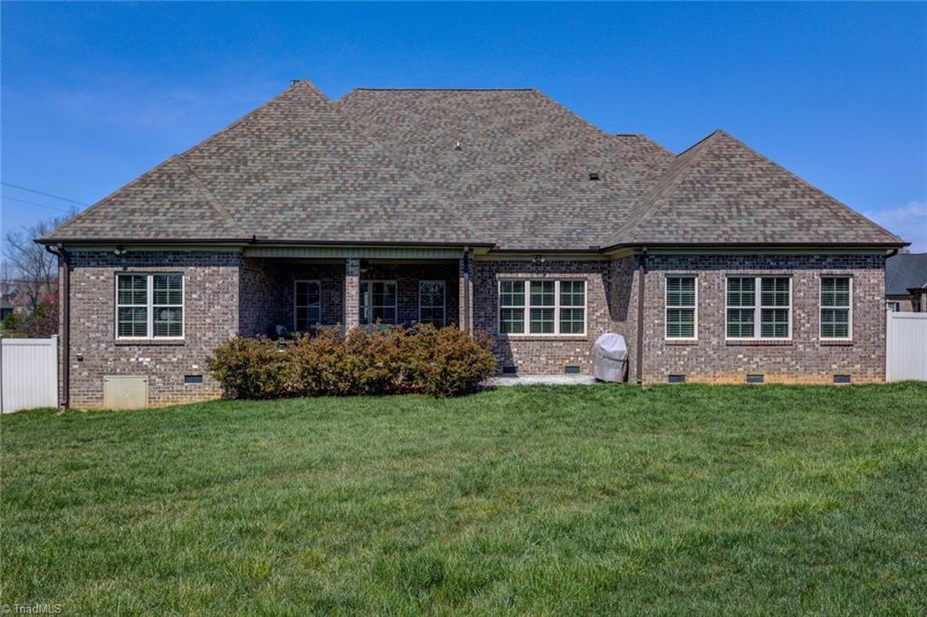 8889 Rymack Drive Oak Ridge, NC 27310 - Photo 29 of 30 A view of the back of this beautiful home.