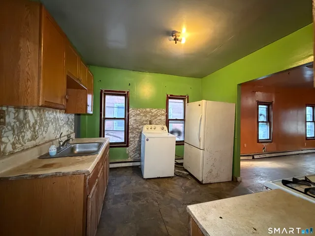 an empty room with a bathroom