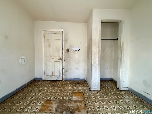 a kitchen with granite countertop a refrigerator and a sink