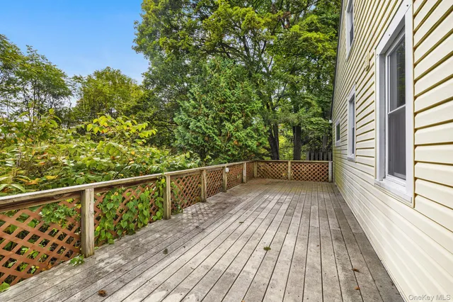a view of balcony with wooden floor