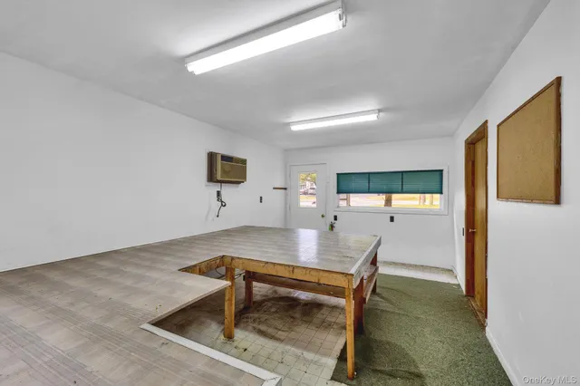 a workspace with furniture and window