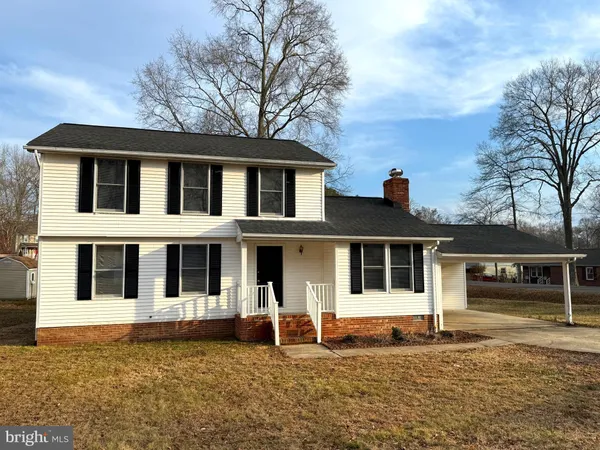 a house with trees in front of it