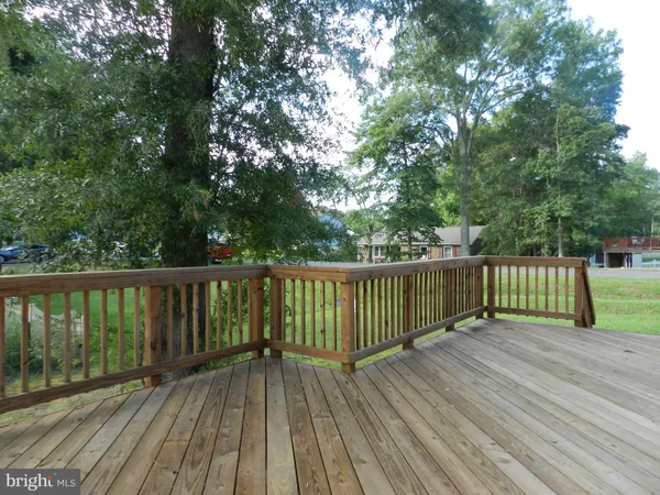 a view of balcony with wooden floor